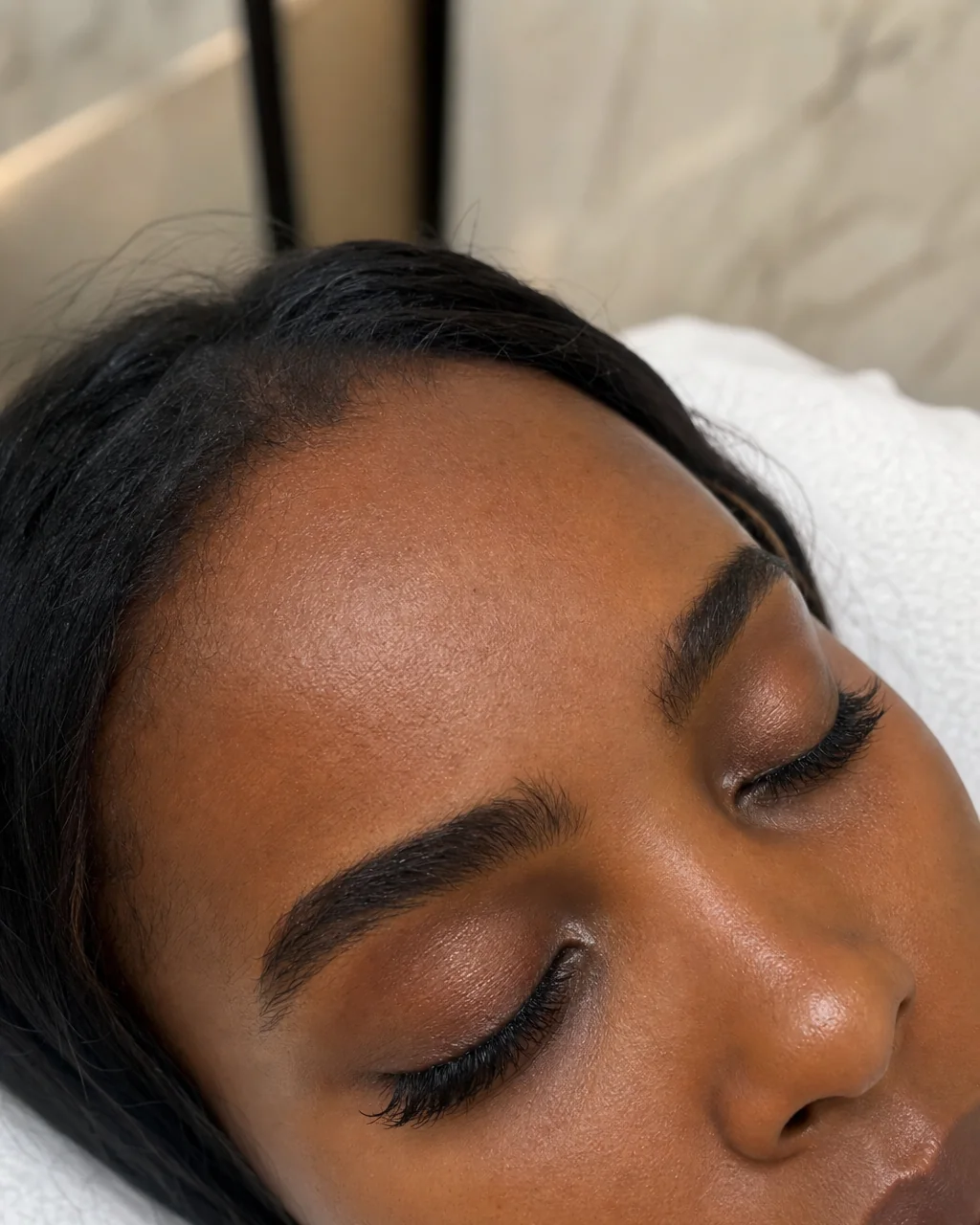 Classic Cluster Lashes close-up on a client during a lash appointment